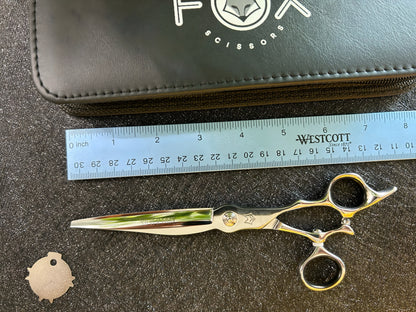 Top view of scissors with ruler for scale.