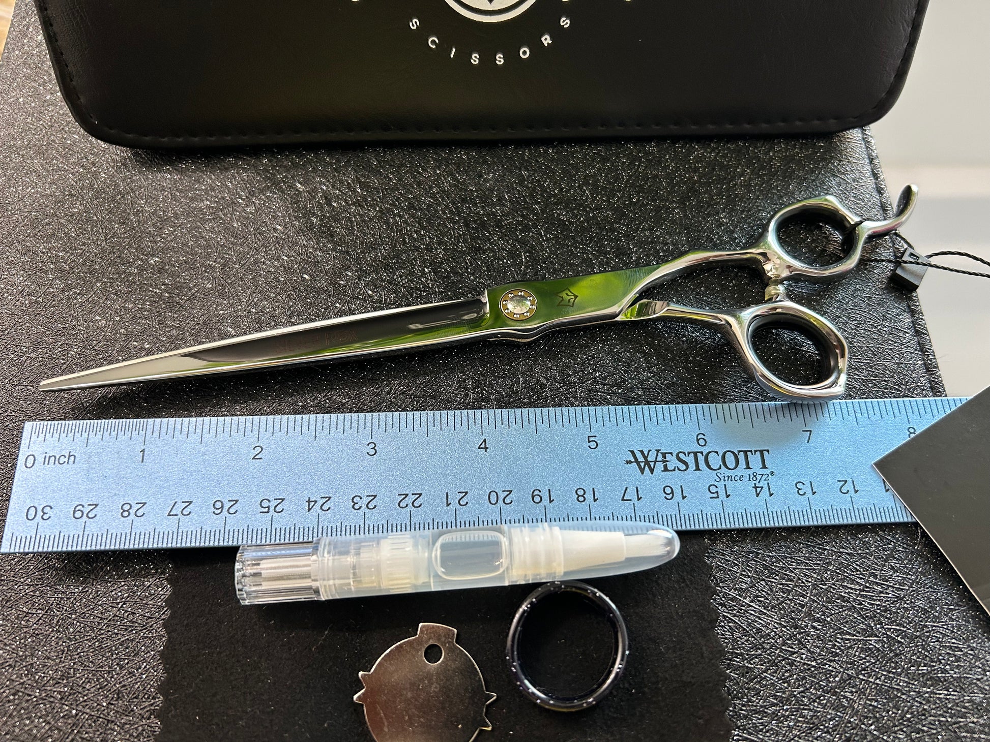 Top view of scissors next to ruler for scale.