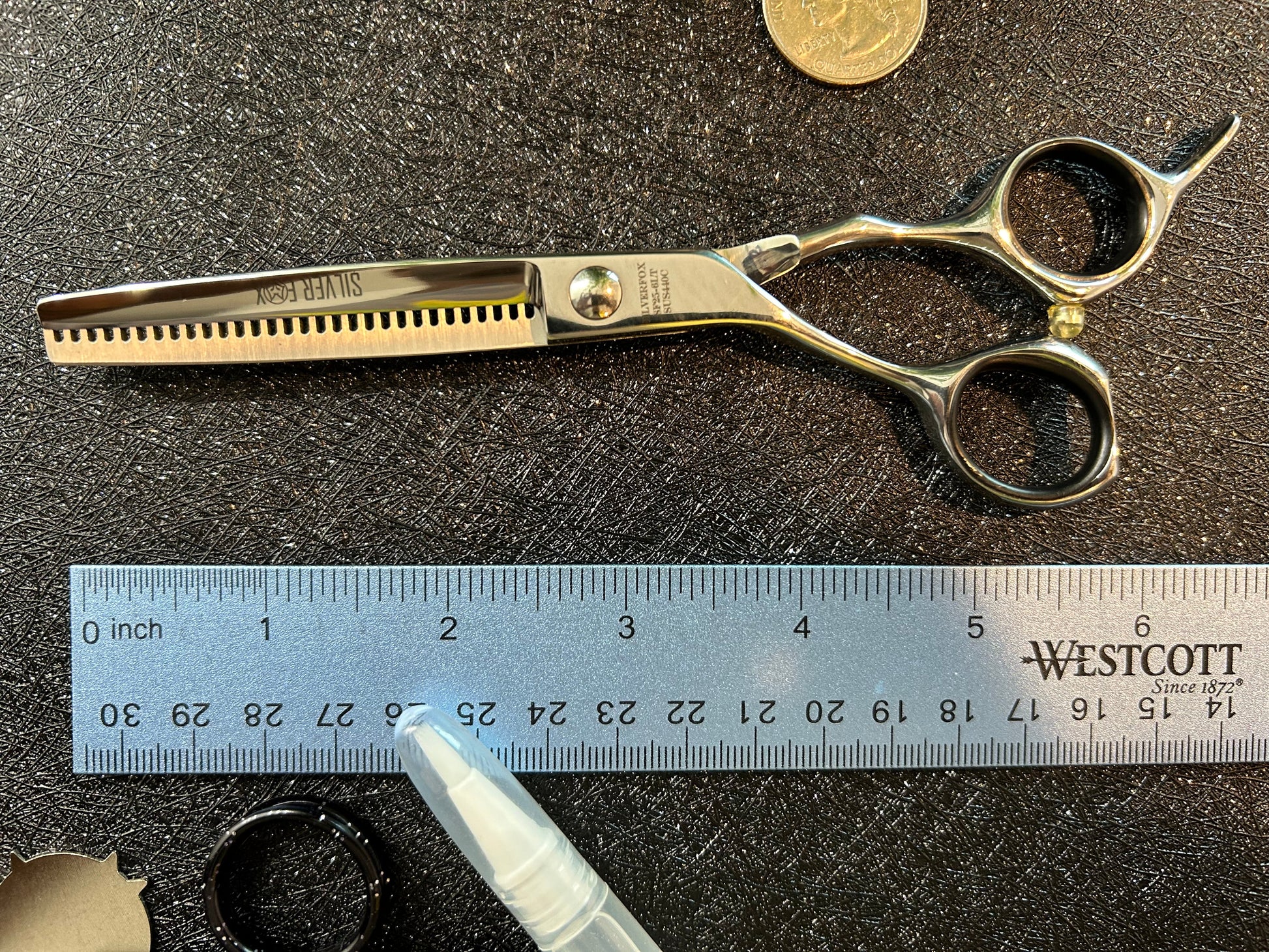 Top view of scissors next to ruler for scale.