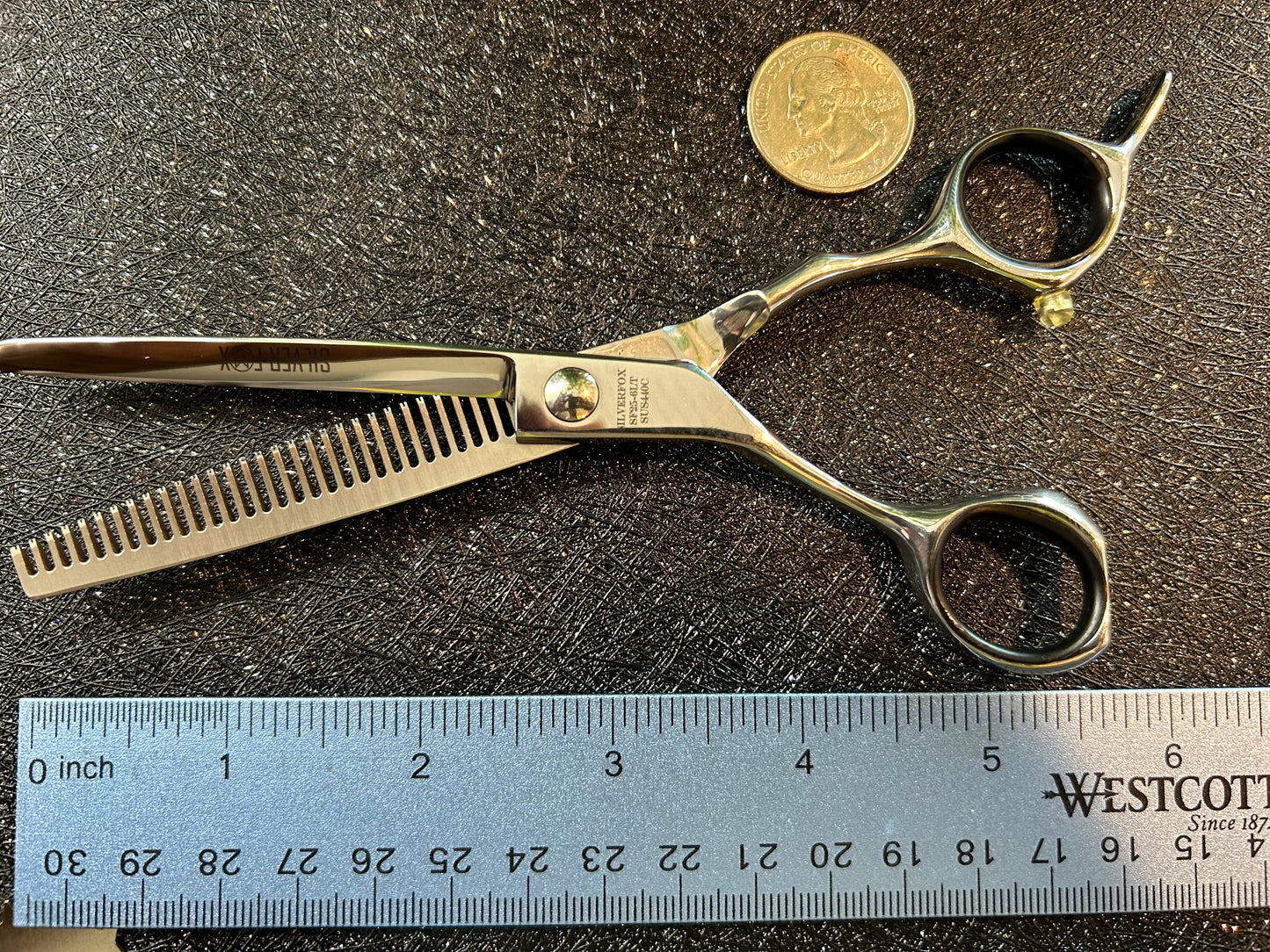 Top view of scissors next to ruler for scale.