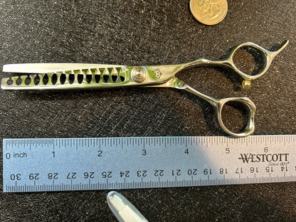 Top view of scissors next to ruler for scale.