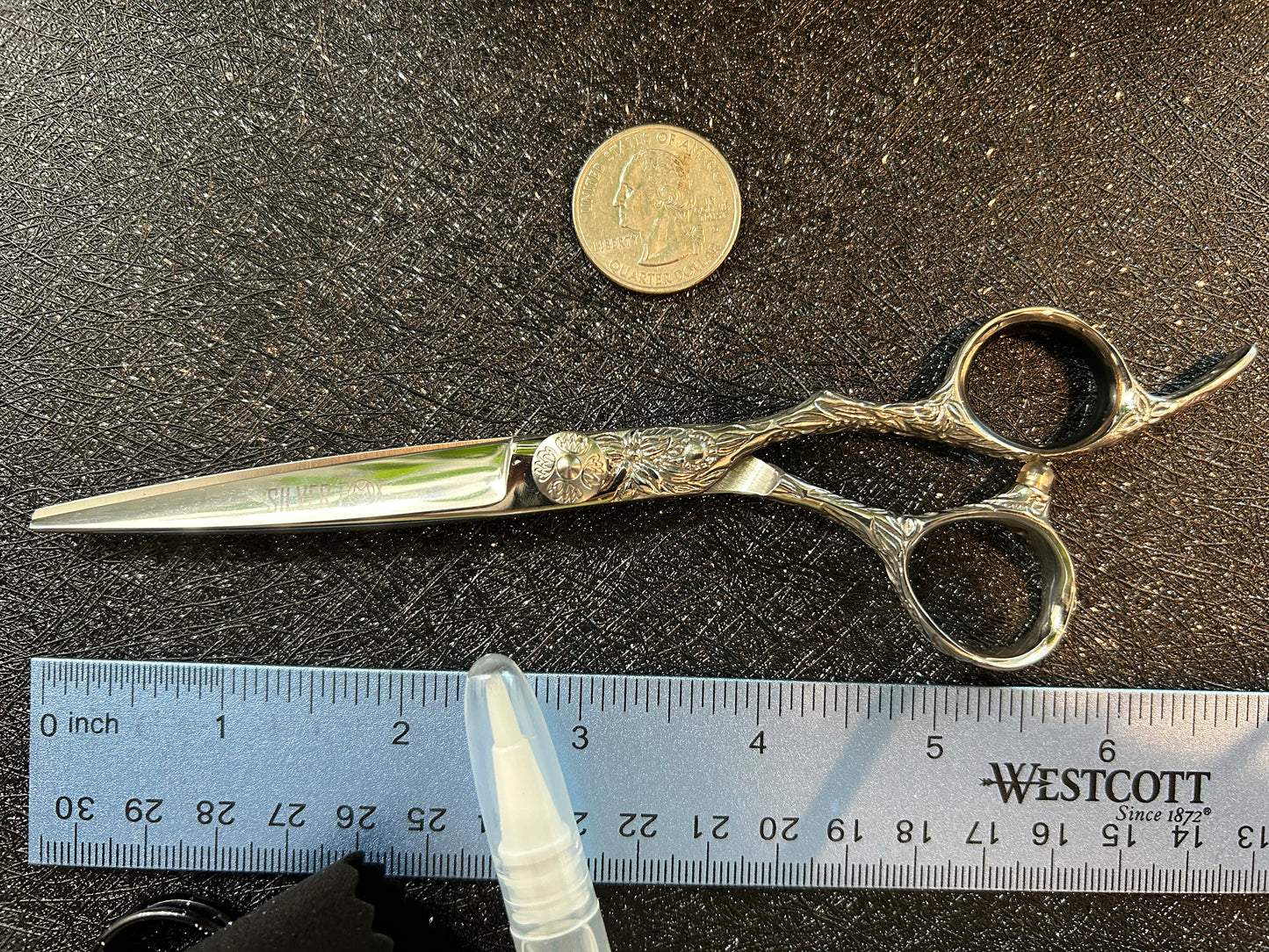 Top view of scissors next to ruler for scale.