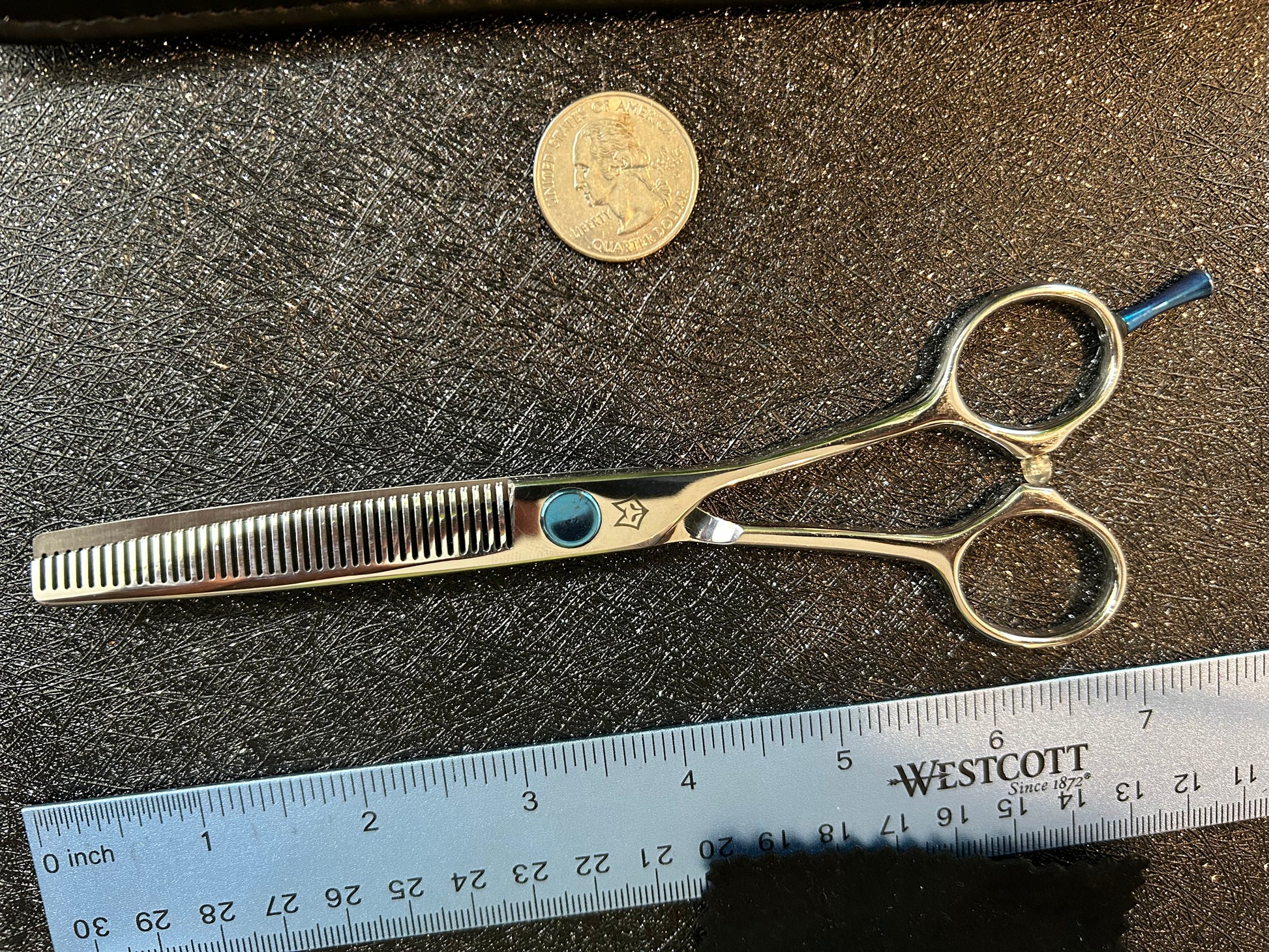 Top view of scissors next to ruler for scale.