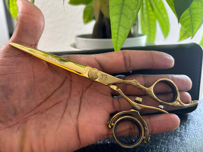 Scissors held in palm of hand.