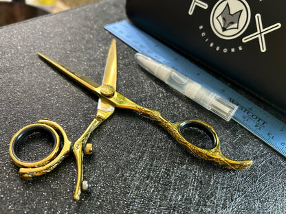 Top view of scissors with ruler for scale.