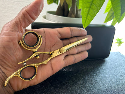 Scissors held in palm of bigger hand.