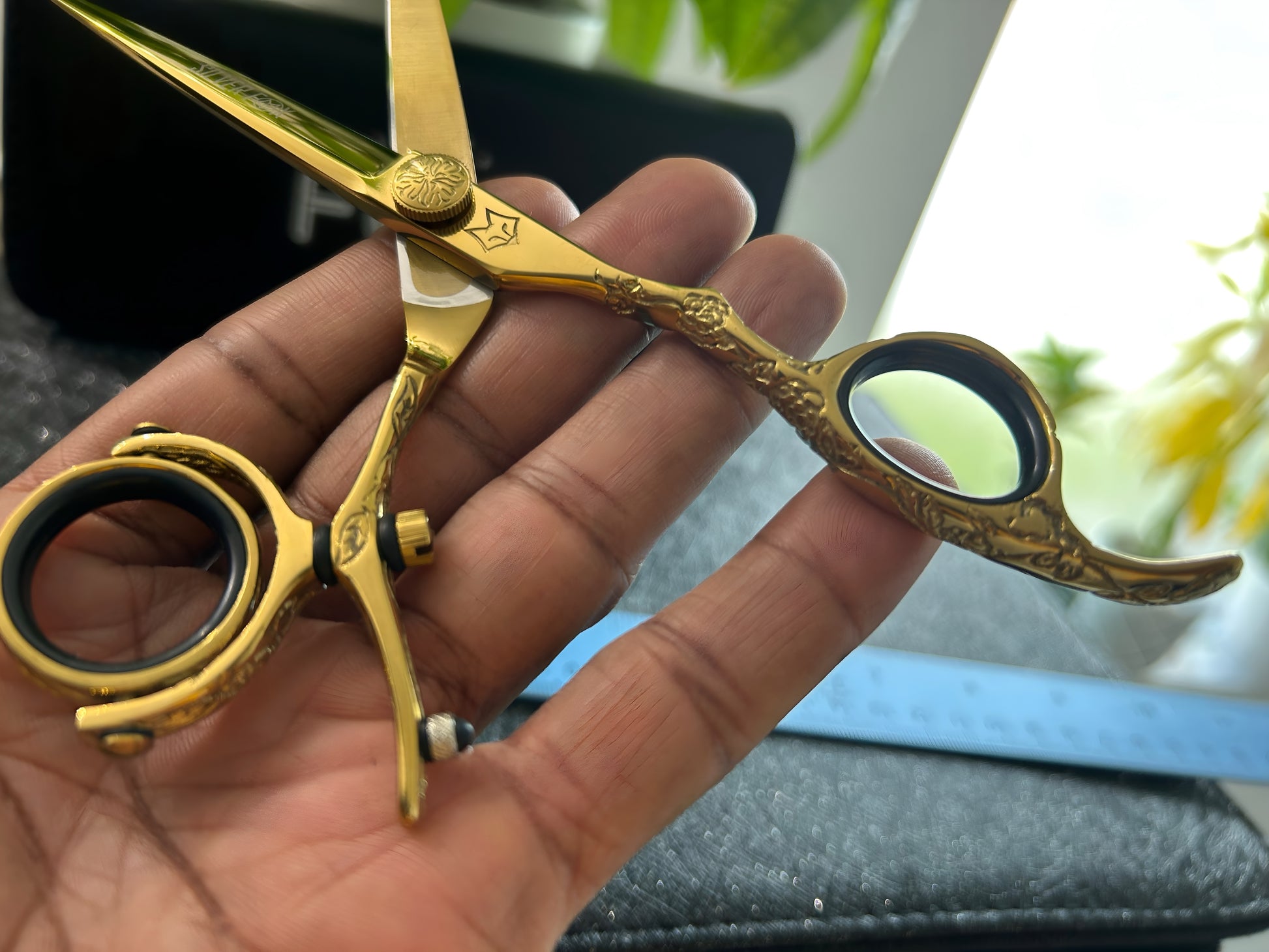 Close up view of scissors held in hand.