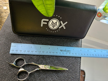 Top view of scissors next to ruler for scale.