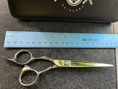 Top view of scissors next to ruler for scale.