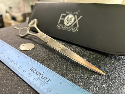 Close up front view of scissors with ruler for scale.