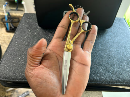 Scissors held in palm of hand.